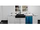 Kitchen with white shaker cabinets and a black farm sink at 3805 Byram Ave, Indianapolis, IN 46208