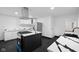 Modern kitchen with white cabinets,hexagon tile floor and quartz countertops at 3805 Byram Ave, Indianapolis, IN 46208