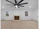 Living room with a fireplace and ceiling fan at 3805 Byram Ave, Indianapolis, IN 46208