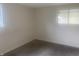 Bedroom with neutral carpeting and a window at 3936 Delmont Dr, Indianapolis, IN 46235