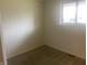 Simple bedroom with neutral walls and carpet at 3936 Delmont Dr, Indianapolis, IN 46235