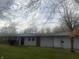 Brick ranch house with attached garage at 3936 Delmont Dr, Indianapolis, IN 46235