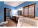 Primary bathroom with soaking tub, double vanity, and updated flooring at 4257 Tattersall Dr, Plainfield, IN 46168