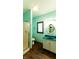 Bathroom with shower, vanity, and updated flooring at 4257 Tattersall Dr, Plainfield, IN 46168