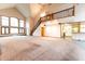 Open living room with kitchen, vaulted ceiling and staircase at 4257 Tattersall Dr, Plainfield, IN 46168