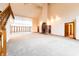 Two-story living room featuring a fireplace and hardwood floors at 4257 Tattersall Dr, Plainfield, IN 46168