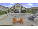 Concrete patio with pool, slide and two orange chairs at 4268 Winners Cir, Bargersville, IN 46106