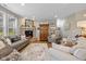 Cozy living room with stone fireplace, comfy sofas, and warm decor at 4768 Harris Pl, Greenwood, IN 46142