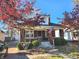 Brick home with a charming front porch and American flag at 6164 Carrollton Ave, Indianapolis, IN 46220