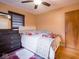 Bright bedroom with a queen-size bed and ample dresser storage at 7125 Linden Dr, Indianapolis, IN 46227