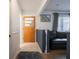 Home entry featuring hardwood floors, a half wall, and a wood door at 7125 Linden Dr, Indianapolis, IN 46227