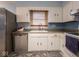 Kitchen sink and dishwasher in white cabinetry at 7125 Linden Dr, Indianapolis, IN 46227