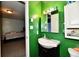 Small bathroom with single sink, toilet and view into bedroom at 7922 S Sherman Dr, Indianapolis, IN 46237