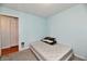 Small bedroom with a bed and access to hallway at 7922 S Sherman Dr, Indianapolis, IN 46237
