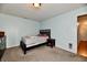 Cozy bedroom with double bed, dresser, and nightstand at 7922 S Sherman Dr, Indianapolis, IN 46237