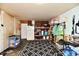 Garage with shelving, refrigerator, and ample storage at 7922 S Sherman Dr, Indianapolis, IN 46237
