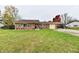 Ranch house with a carport and spacious front yard at 7922 S Sherman Dr, Indianapolis, IN 46237