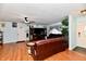 Living room with hardwood floors, leather sofas, and a ceiling fan at 7922 S Sherman Dr, Indianapolis, IN 46237