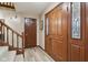 Inviting entryway with hardwood floors and staircase at 9250 Woodacre S Blvd, Indianapolis, IN 46234