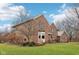 Brick home showcasing a side view and landscaping at 9250 Woodacre S Blvd, Indianapolis, IN 46234