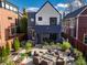 Modern home's backyard features a patio, fire pit, and lush landscaping at 1634 N New Jersey St, Indianapolis, IN 46202