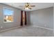 Bedroom with gray walls, ceiling fan, and burgundy curtains at 18878 Pilot Mills Dr, Noblesville, IN 46062