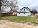 Large backyard with mature trees and partial fencing at 310 S Pleasant St, Edinburgh, IN 46124