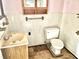 Small bathroom with a toilet, sink, and shower at 310 S Pleasant St, Edinburgh, IN 46124