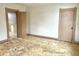 Empty bedroom with damaged flooring and doors at 310 S Pleasant St, Edinburgh, IN 46124