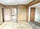 Empty bedroom with wood paneling and doors at 310 S Pleasant St, Edinburgh, IN 46124