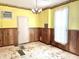 Features yellow walls, wood paneling, and a chandelier at 310 S Pleasant St, Edinburgh, IN 46124