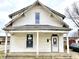 White sided home with front porch and mature trees at 310 S Pleasant St, Edinburgh, IN 46124