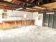 Unfinished garage with workbench and extra storage space at 310 S Pleasant St, Edinburgh, IN 46124