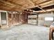 A large empty garage with wooden beams and concrete floor at 310 S Pleasant St, Edinburgh, IN 46124