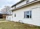 White sided home with a detached garage and a well-maintained lawn at 310 S Pleasant St, Edinburgh, IN 46124