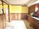 Kitchen with wood cabinets and a brick backsplash at 310 S Pleasant St, Edinburgh, IN 46124