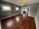 Empty dining room featuring hardwood floors and gray walls at 3435 Carrollton Ave, Indianapolis, IN 46205