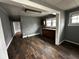 View of kitchen from dining area, featuring brown cabinets at 3435 Carrollton Ave, Indianapolis, IN 46205