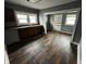 Simple kitchen with brown cabinets and wood-look flooring at 3435 Carrollton Ave, Indianapolis, IN 46205