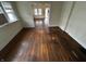 Living room with hardwood floors and access to other rooms at 3435 Carrollton Ave, Indianapolis, IN 46205