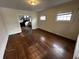 Living room with hardwood floors and access to other rooms at 3435 Carrollton Ave, Indianapolis, IN 46205
