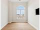 Bright bedroom featuring hardwood floors and an arched window at 41 N Rangeline Rd # 7, Carmel, IN 46032
