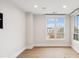 Bright bedroom with hardwood floors and large windows at 41 N Rangeline Rd # 7, Carmel, IN 46032