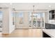 Bright dining room with hardwood floors and a chandelier at 41 N Rangeline Rd # 7, Carmel, IN 46032