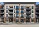 Modern brick building with multiple balconies and street-level entrances at 41 N Rangeline Rd # 7, Carmel, IN 46032