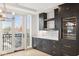 Dark kitchen cabinets, quartz countertops and a wine cooler at 41 N Rangeline Rd # 7, Carmel, IN 46032