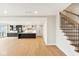 Open concept kitchen with island and hardwood floors at 41 N Rangeline Rd # 7, Carmel, IN 46032