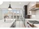 Spacious kitchen with island, stainless steel appliances, and white cabinets at 41 N Rangeline Rd # 7, Carmel, IN 46032
