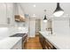 Modern kitchen with island, white and dark cabinets, and a walk-in pantry at 41 N Rangeline Rd # 7, Carmel, IN 46032