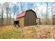 Rustic barn with red metal roof and attached run at 6465 Mt Moriah Rd, Nineveh, IN 46164